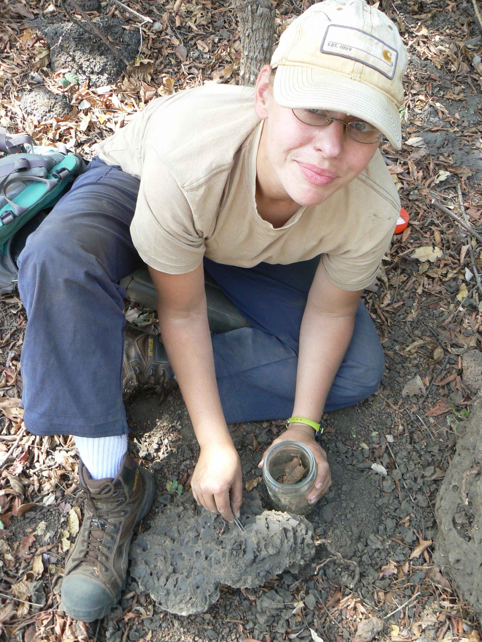 Stacey Linshield in the field collecting termite samples to learn more about the chimpanzee diet