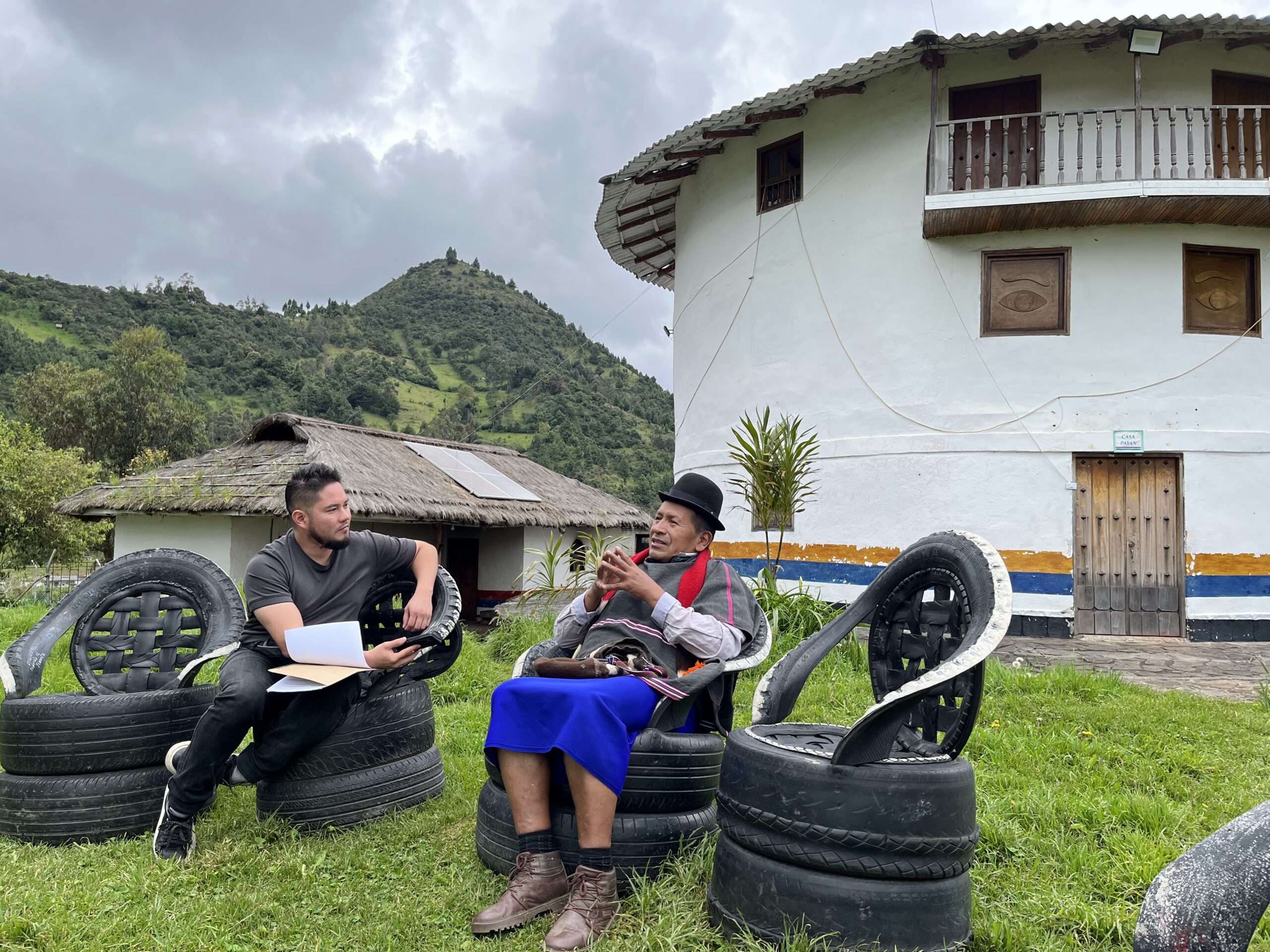 Juan Manuel Arevalo Viveros speaking about social and environmental transitions toward habitability with the Taita Luis Felipe Muelas in the Misak Indigenous Reservation of Guambia (Cauca - Colombia) in front of the Museum Home Payán.